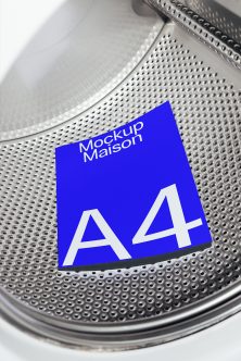 Blue A4 paper mockup on textured metal drum machine surface