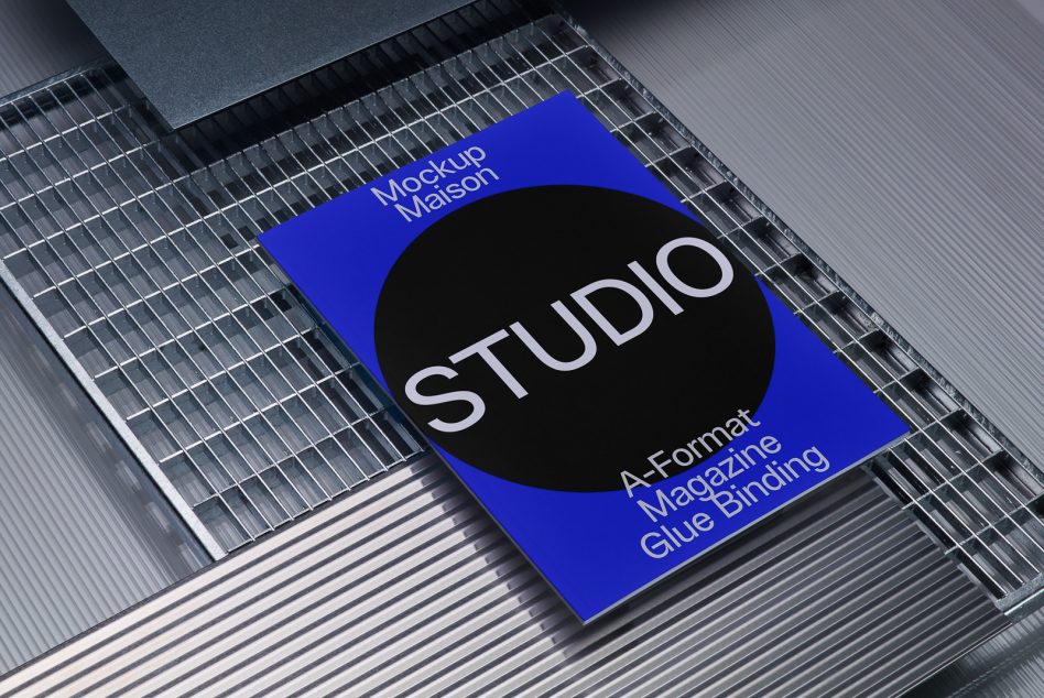 Bright blue A-Format magazine with glue binding showing large black circular cutout