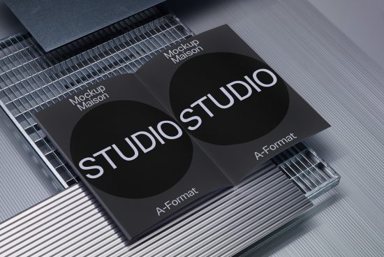 Professional studio mockup with sleek black brochure design on metallic wireframe, showcasing clean typography. Perfect for branding presentations.