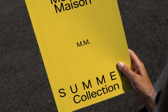 Person holding a yellow book cover mockup for SUMMER Collection, clear design space, graphic designers, realistic presentation.