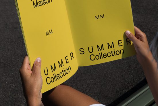 Close-up of hands holding a yellow pamphlet mockup with Summer Collection text, clear font, showcasing a design template for presentations.