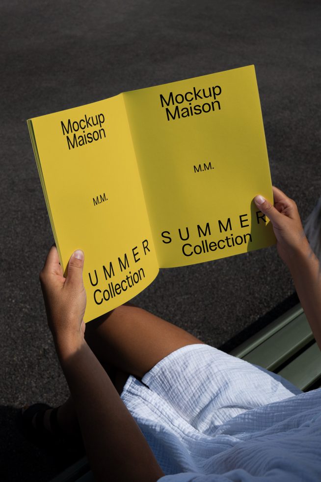 Person holding open brochure mockup with yellow cover showcasing design for a summer collection, ideal for graphic designers and marketing templates.