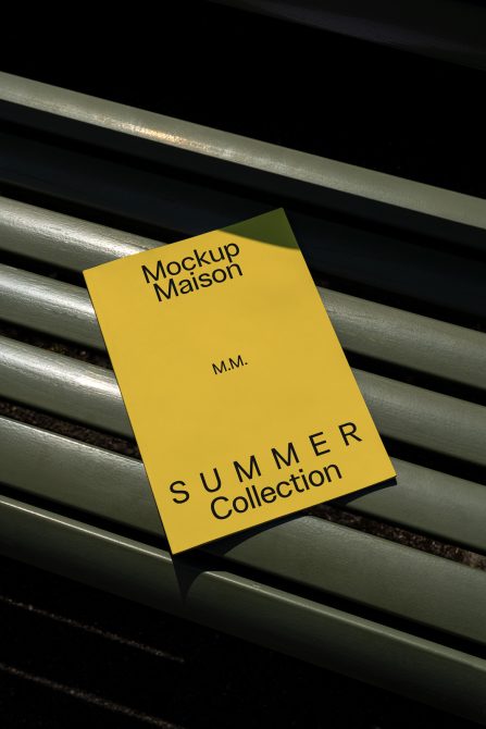 Yellow flyer mockup with text design, resting on park bench, shadows casting over, ideal for showcasing summer collection graphics and templates.