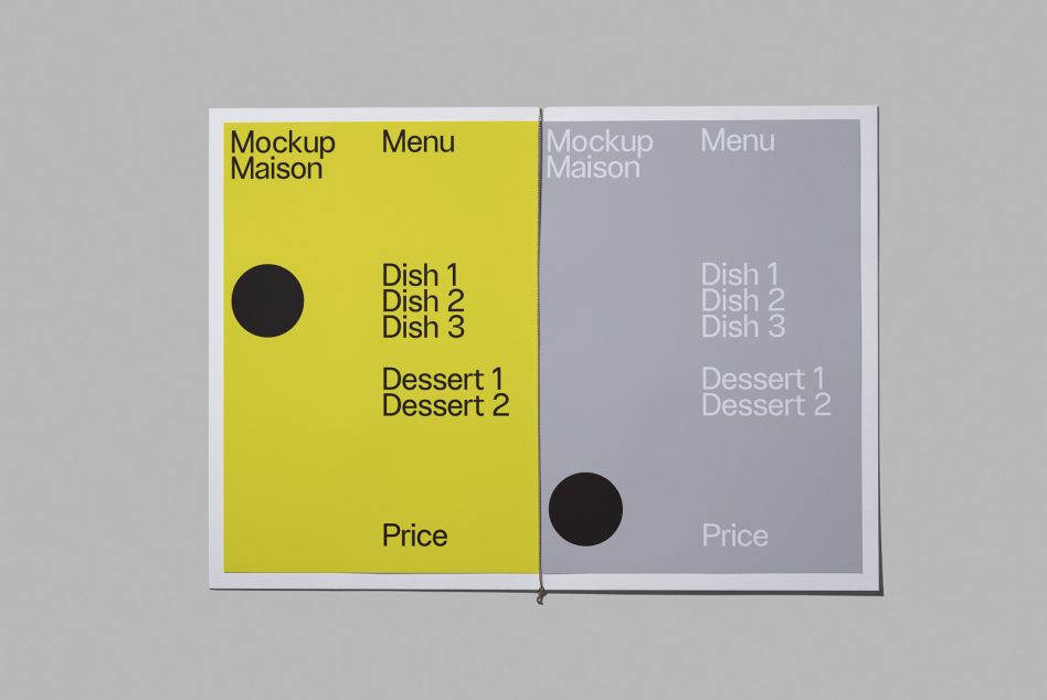 Open spread showing yellow left page with menu items, lavender right page, black circles