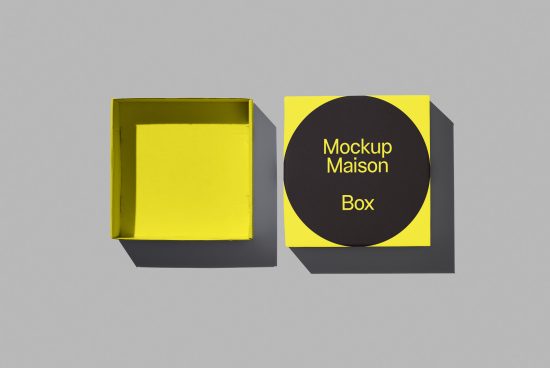 Yellow and black open box mockup with clean design on a gray background, ideal for presentation and packaging design projects.