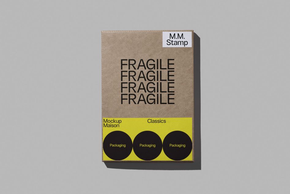 Kraft cardboard box with fragile label, yellow strip below