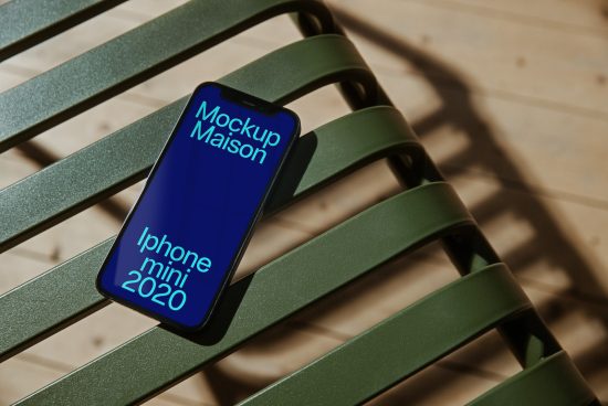 Stylish iPhone Mini 2020 mockup on a green chair with shadows, ideal for showcasing mobile app designs and responsive web templates.