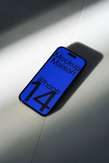 Bright blue iPhone 14 mockup angled on neutral gray surface