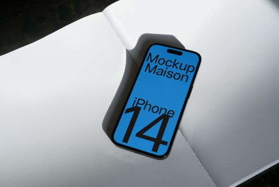 Modern iPhone 14 mockup on white paper sheets, showcasing screen design, ideal for app presentation and UI/UX design projects.