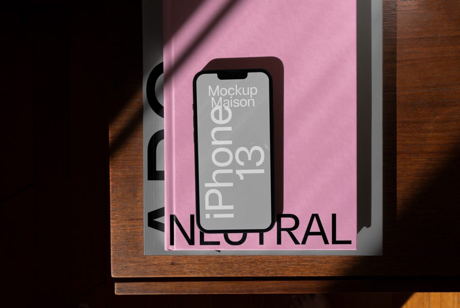 iPhone 13 mockup on pink poster frame with wood edges