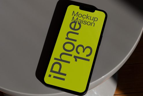 Smartphone screen mockup on a table for showcasing mobile app design, ideal for designers seeking sleek presentations.