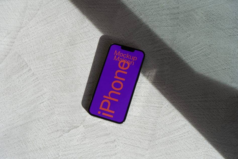 iPhone mockup with bold purple screen on soft linen fabric surface
