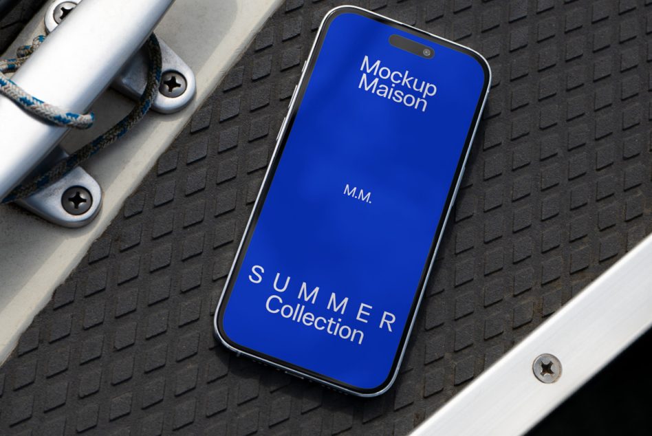 Blue iPhone on industrial mat showing Summer Collection text with rope detail
