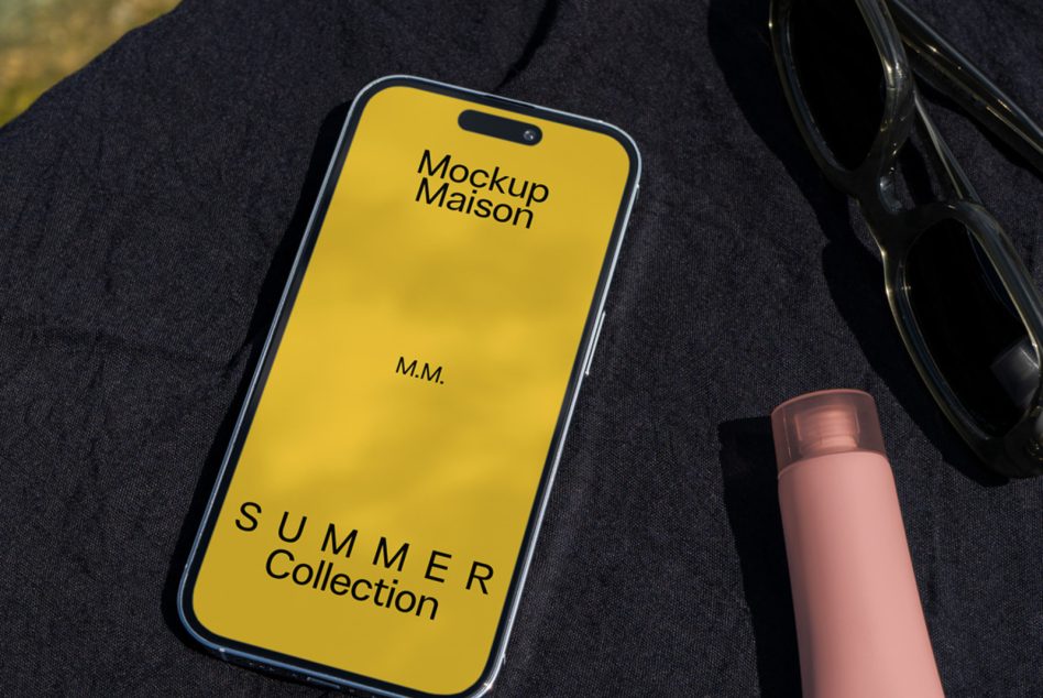 Smartphone screen mockup with summer collection ad, placed on fabric beside sunglasses and lipstick, ideal for presenting app designs.