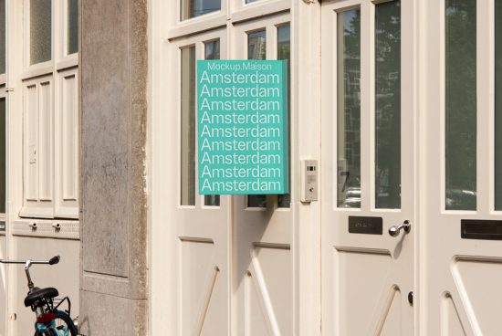 Urban storefront mockup displaying green poster with repeating text 'Amsterdam' for showcasing font and design work, with bike and door intercom in view.