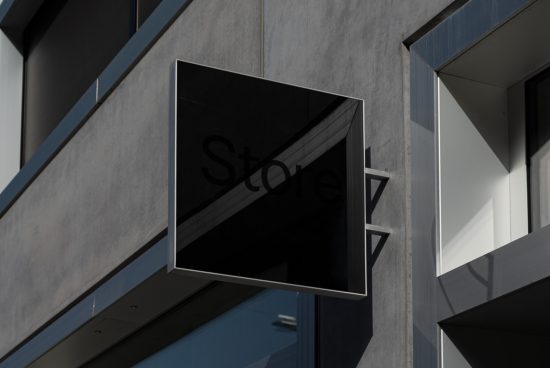 Modern storefront sign mockup on a concrete building exterior for graphic design branding display.