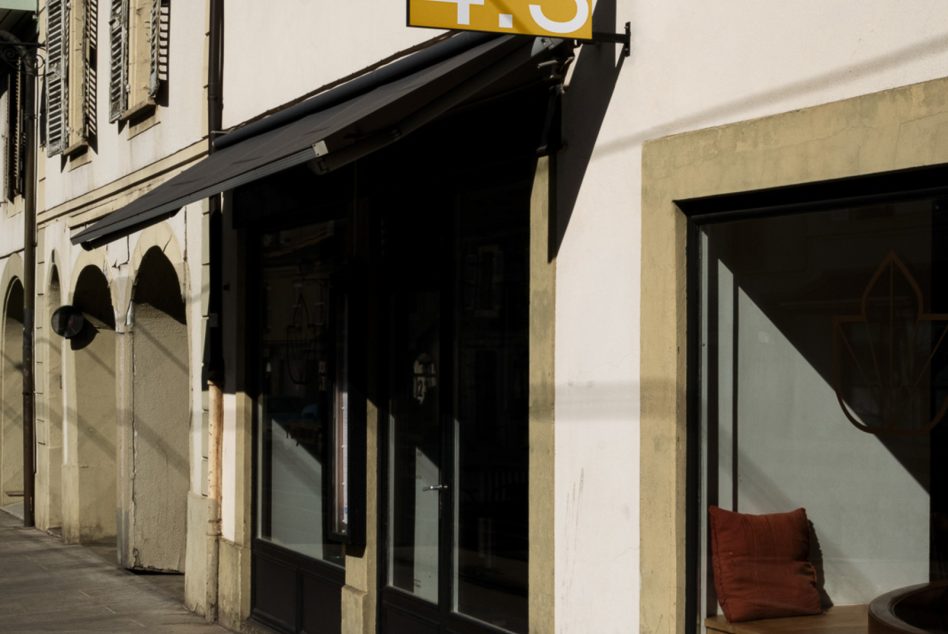 Storefront mockup with signage, elegant architecture details, and warm lighting, ideal for brand presentation and design projects.