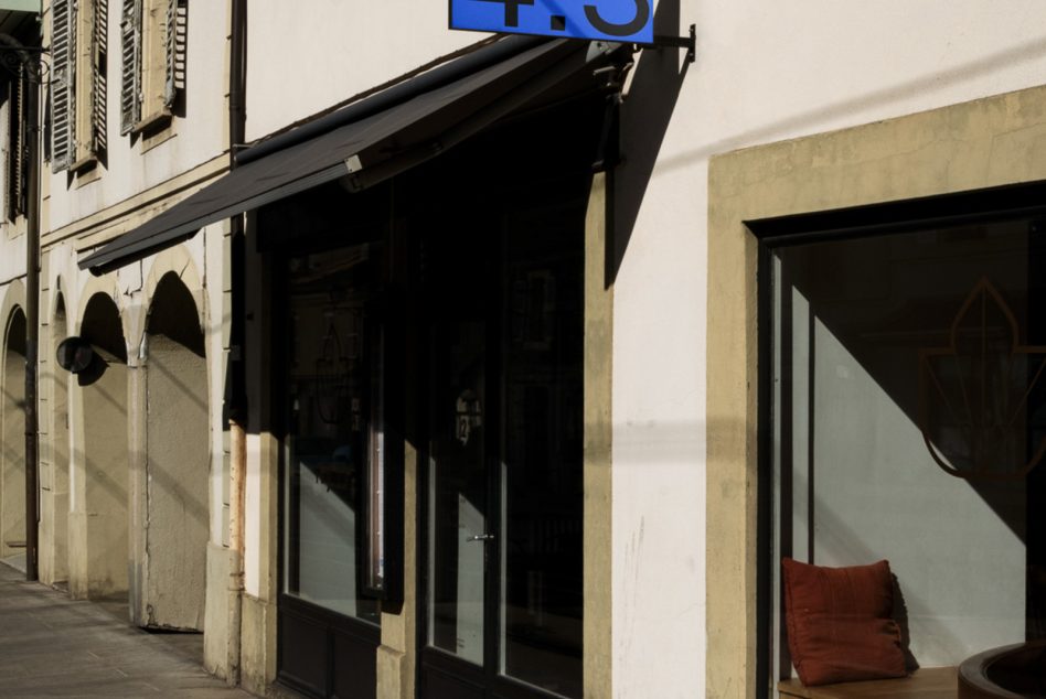 Street view of a shopfront with classic architecture, ideal for store branding mockups, urban templates, and storefront graphics design.