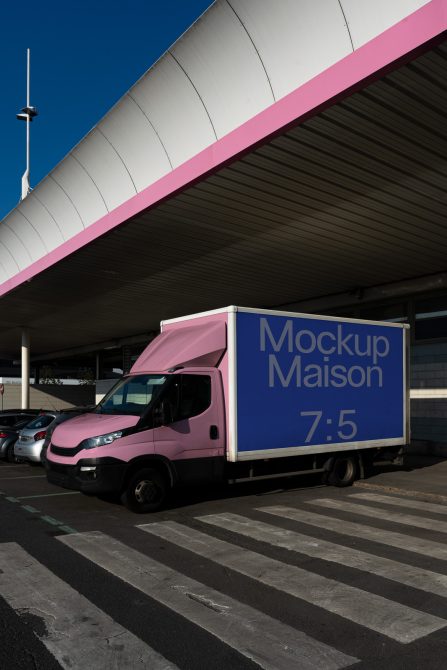 Delivery truck with mockup branding parked under a shelter, ideal for showcasing vehicle wrap designs, graphics, and branding mockups.