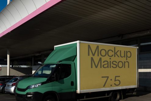 Delivery truck mockup under a shelter with editable side panel for showcasing branding designs, suitable for graphic designers.