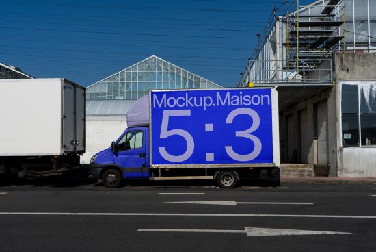 Blue delivery truck with large ad mockup side panel in urban setting, ideal for display advertising, vehicle branding, and urban mockups for designers.