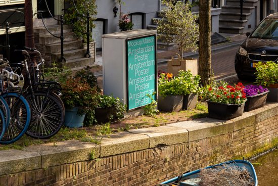 Urban poster mockup on a street sign with plants and bicycles, suited for showcasing design templates and graphics in a real-life context.