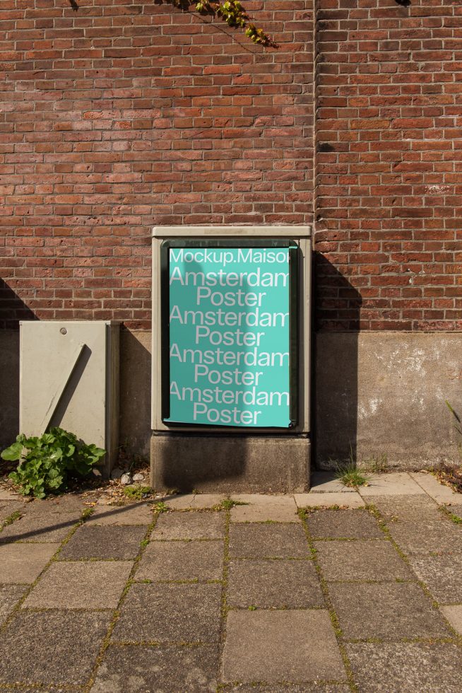 Urban poster mockup on a sidewalk with a brick wall in the background, showcasing clean design for graphic presentations.