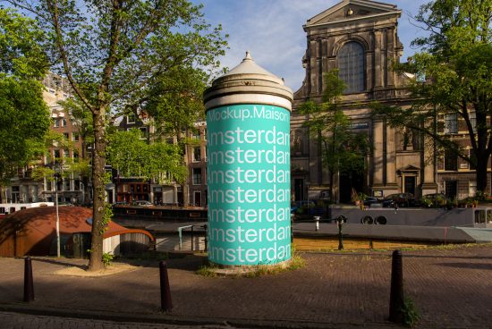 Urban mockup cylinder with text overlay for advertisement in an Amsterdam street scene, showcasing design versatility for outdoor mockups.