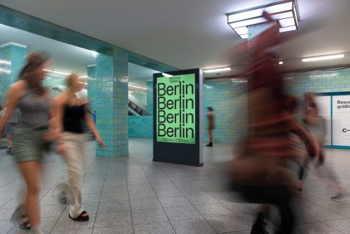 Urban subway station advertisement mockup featuring a poster with bold typography, busy commuters, and teal tiles, ideal for modern marketing design templates.