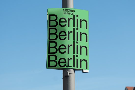City poster mockup featuring the word Berlin repeated four times in bold font, displayed on an outdoor sign under a clear blue sky.