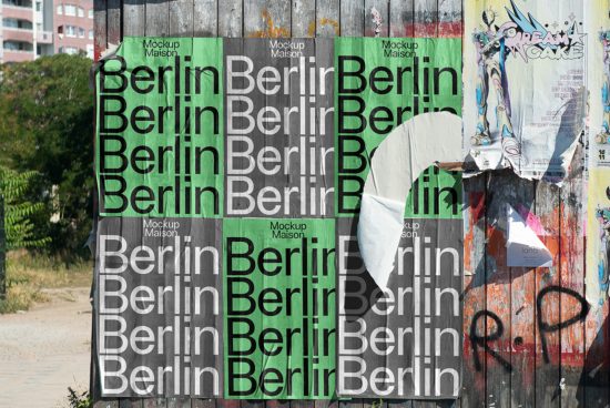 Urban poster mockup on a wooden wall with graffiti and torn layers showcasing Berlin text design, ideal for street-style graphics display.