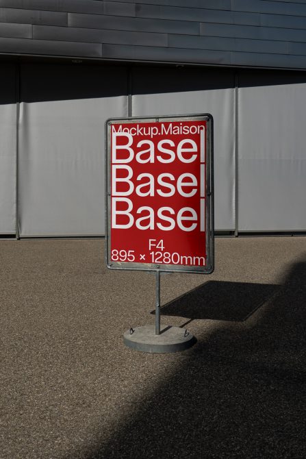 Standing outdoor advertising board mockup in daylight with bold red and white design and typography, urban background, design asset for presentation.