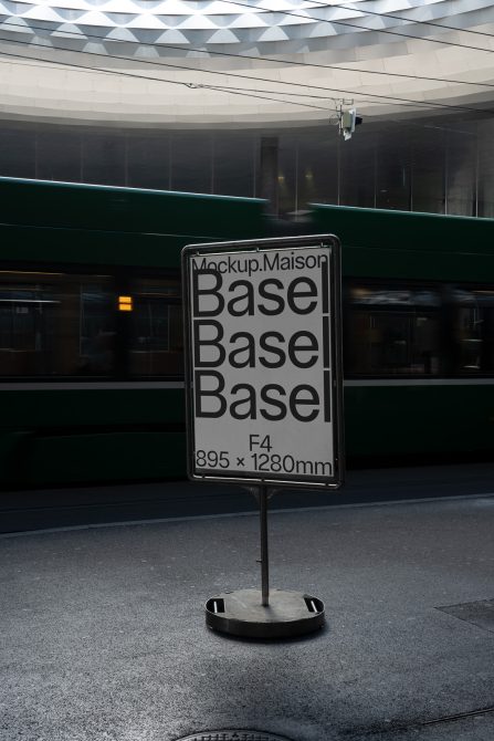 Urban billboard mockup displaying signage design, standing on a city street with modern architecture and a moving tram in the background.