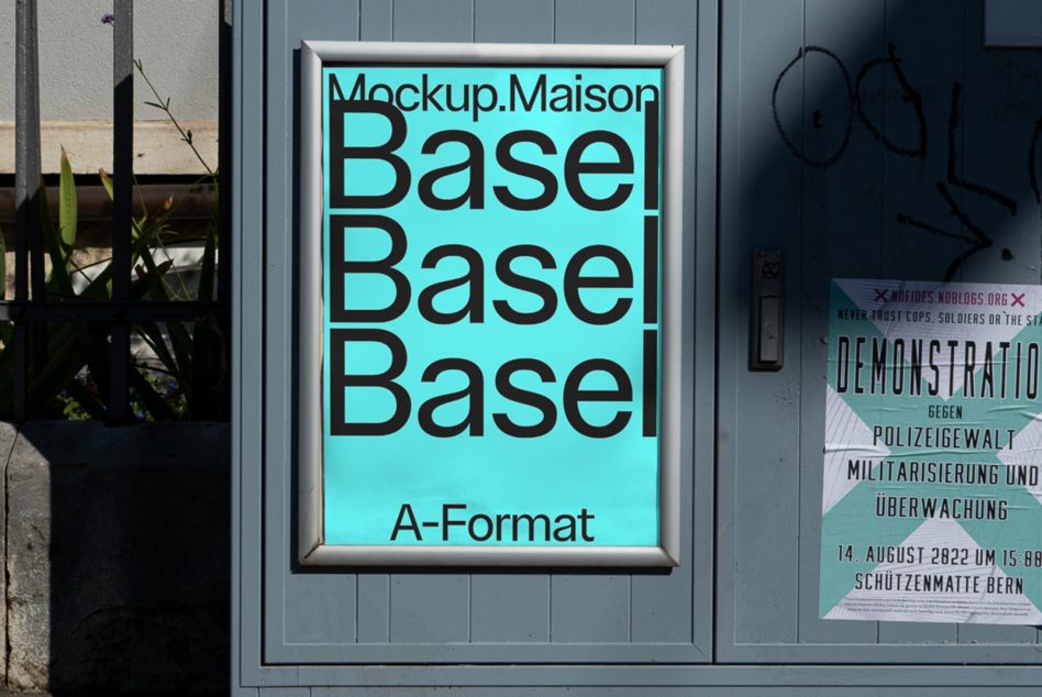 Cyan A-Format poster mockup in silver frame on gray storefront door
