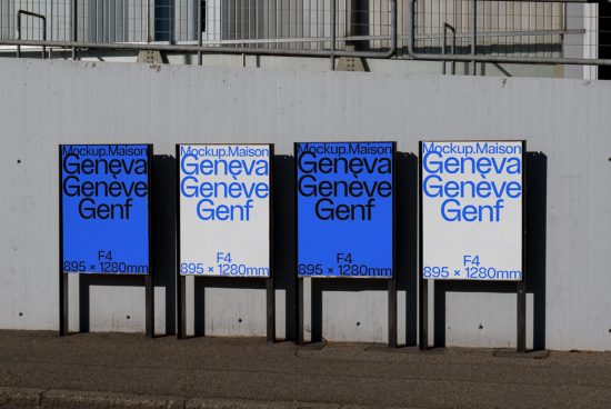 Outdoor billboard mockups displaying blue advertisement posters with text, standing against concrete wall—ideal for urban mockup designs.