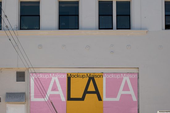 Urban building wall with a colorful mockup design billboard, including the text "Mockup.Maison" for outdoor advertising presentations.