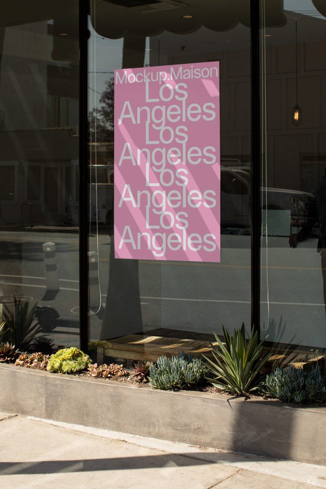 Window poster mockup with pink Los Angeles text, reflecting urban street view for graphic designers, editable PSD for branding display.