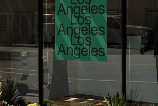 Urban font design showcasing 'Los Angeles' in varying sizes on a window poster, reflecting city streets for graphics and mockups.