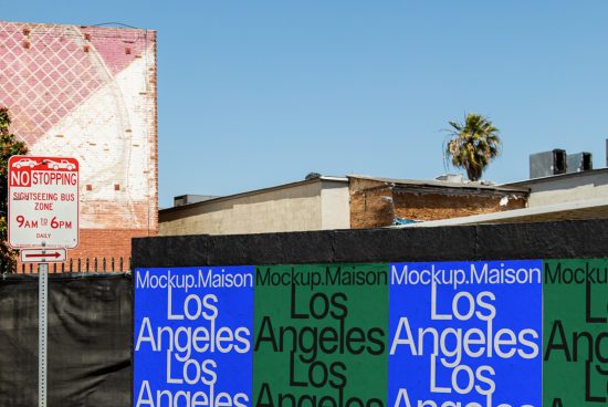 Urban billboard mockup with clear blue sky and Los Angeles text, ideal for designers to showcase advertising graphics.