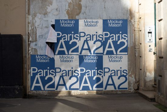 Urban poster mockup on a worn wall with peeling paint, displaying Paris and A2 graphic design in blue and white.