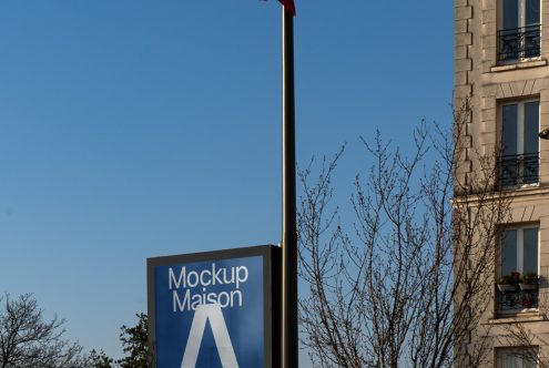 Urban billboard mockup on a clear day for outdoor advertising designs, showcasing fonts and graphics display potential for designers.