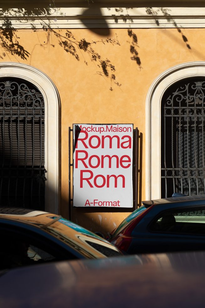 Urban poster mockup on a sunny wall displaying text variations for Roma with tree shadows, suitable for graphic design presentations.