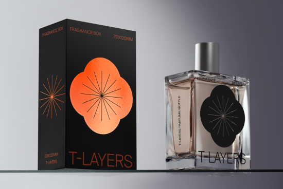 Elegant perfume packaging mockup featuring a black box with bold floral design and a clear fragrance bottle, ideal for presentation and branding.