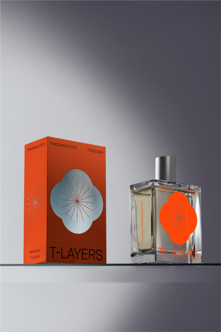 Perfume bottle and packaging mockup with modern design, orange gradient, and silver graphics on a sleek background. Ideal for presentations and branding.