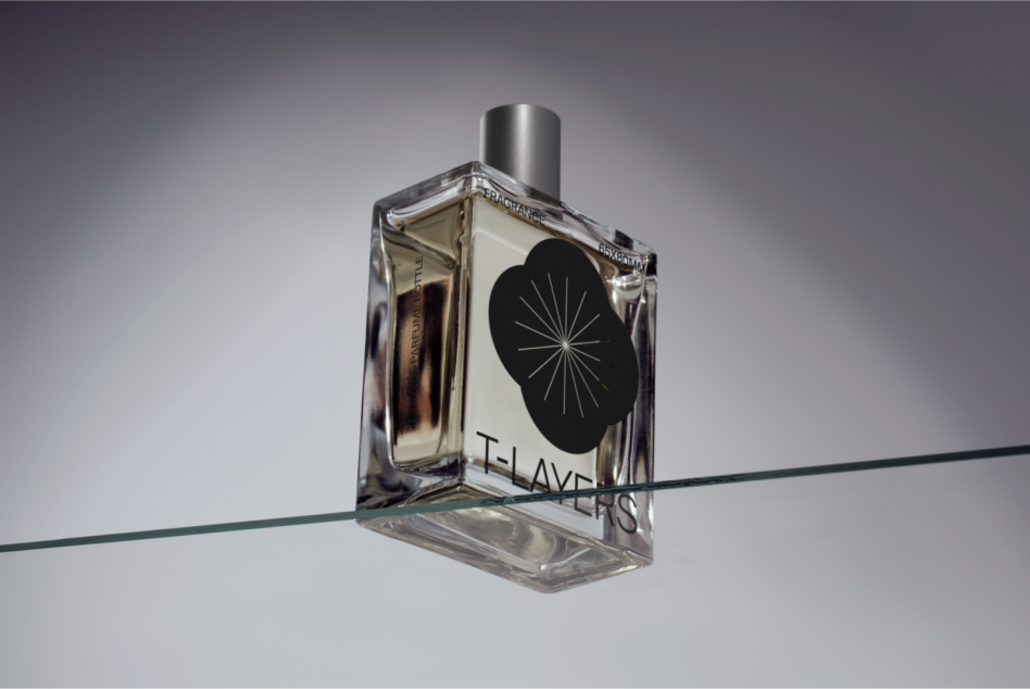 Minimalist fragrance bottle mockup with geometric logo on glass, balanced on wire