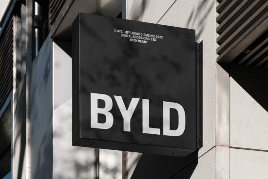 Outdoor signage mockup featuring bold typography design BYLD on a building facade for graphic display presentation.