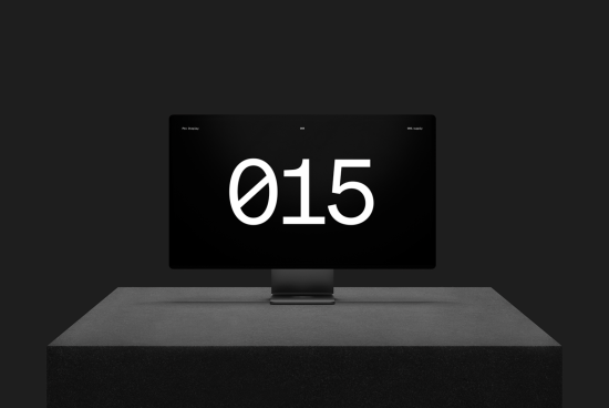 Modern computer monitor on stand displaying stylized number 015, ideal for graphic templates, font showcase, and sleek mockup design.