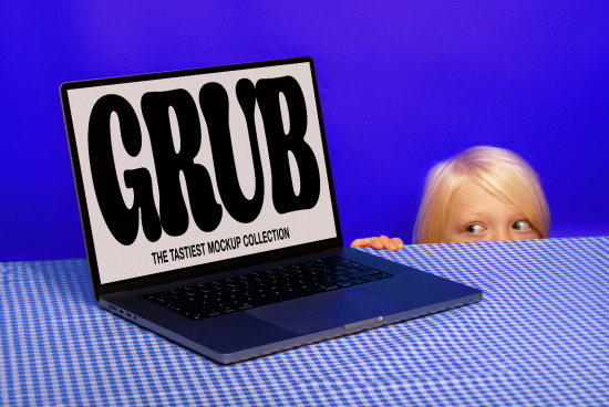 Laptop screen displaying bold GRUB text mockup with child peeking, vibrant blue background, designer asset for creative font presentation.