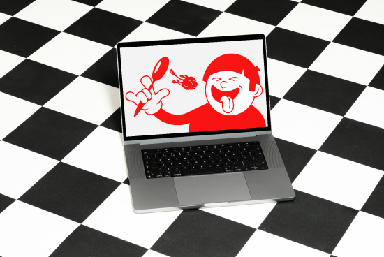 Laptop on checkered floor displaying cartoon character graphic design, vibrant digital artwork perfect for mockup, graphics category.