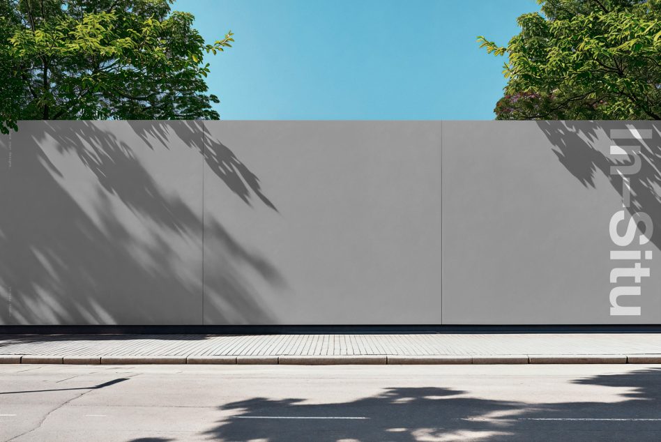 Urban billboard mockup on a clear day with tree shadows, suitable for advertising designs and cityscape graphic presentations.